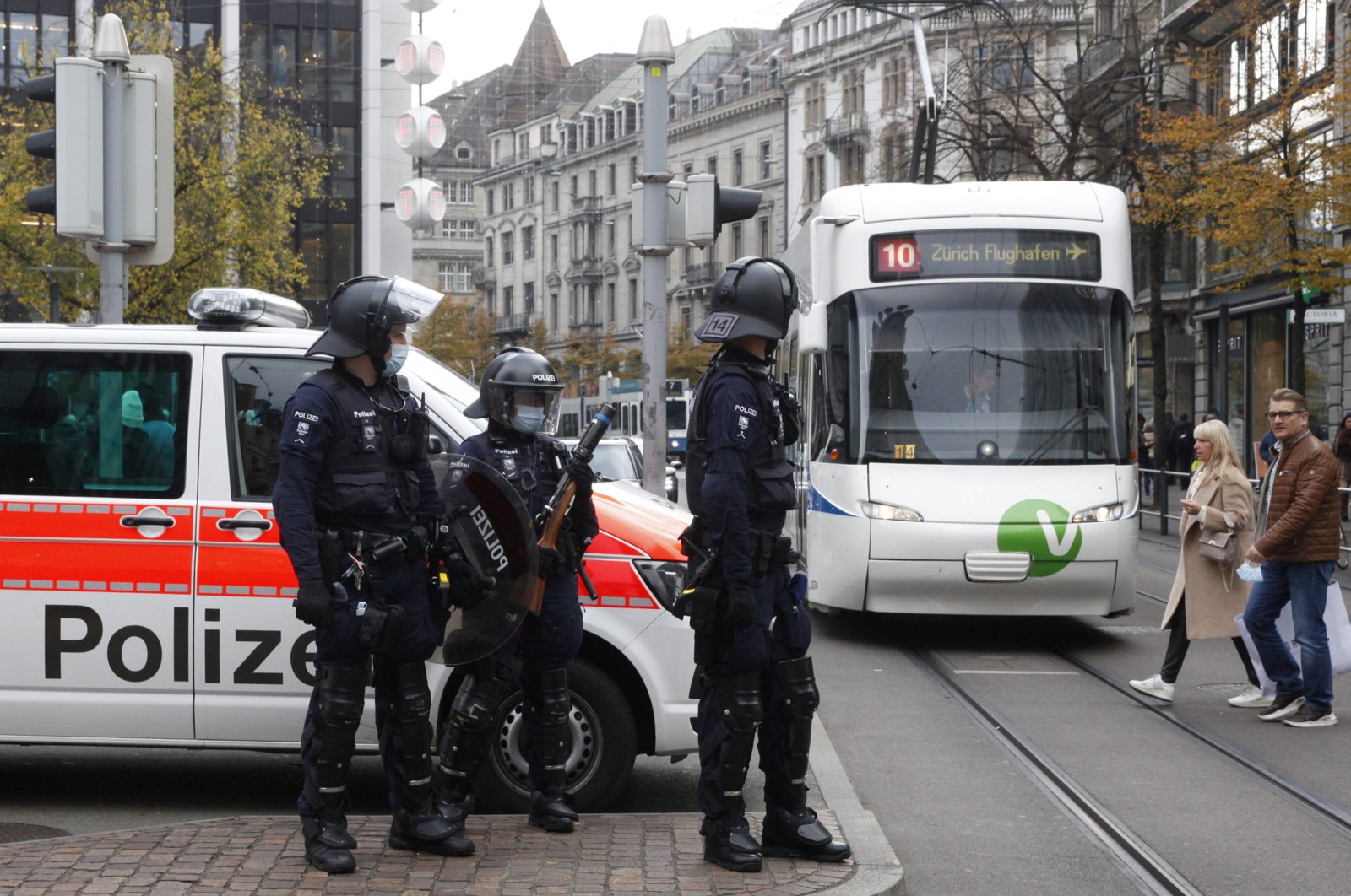 Swiss police officers stand guard during an unauthorized demonstration against COVID-19 restrictions at the Bahnhofstrasse shopping street in Zurich, Switzerland, Oct. 30, 2021. (Reuters File Photo)