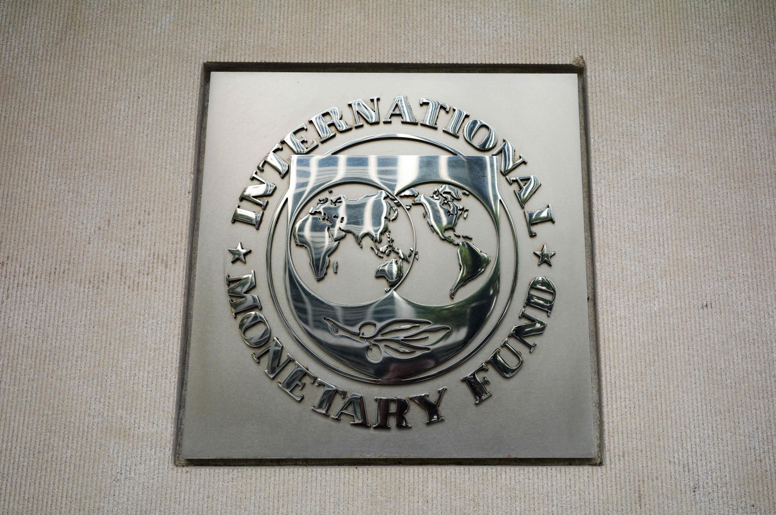 The seal of the IMF is seen outside of its headquarters in Washington, DC., U.S., Oct. 7, 2021. (AFP Photo)