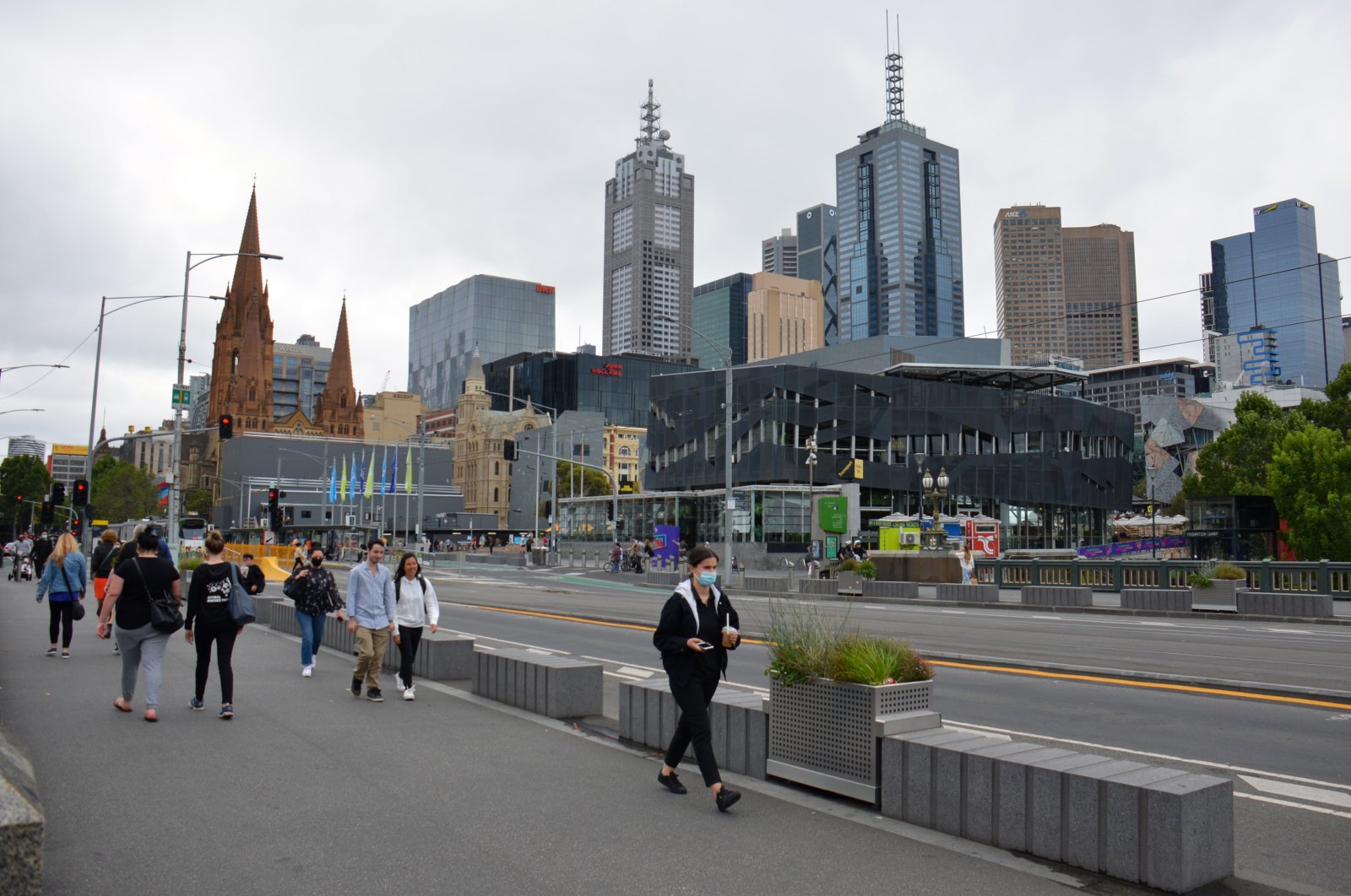 People walk on a street in Melbourne, Australia, Jan. 8, 2022. (AA Photo)
