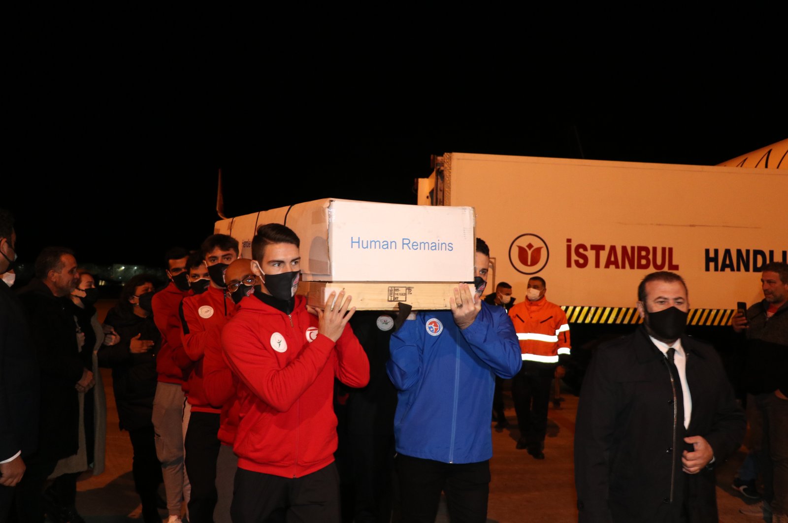 The coffin of Turkish Cypriot mountaineer Birkan Uzun is carried by national athletes at Ercan Airport, TRNC, Jan. 9, 2022. (AA photo)