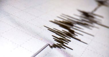 A seismometer printing line records earthquake tremors on white paper, Aceh, Indonesia. (Shutterstock Photo)