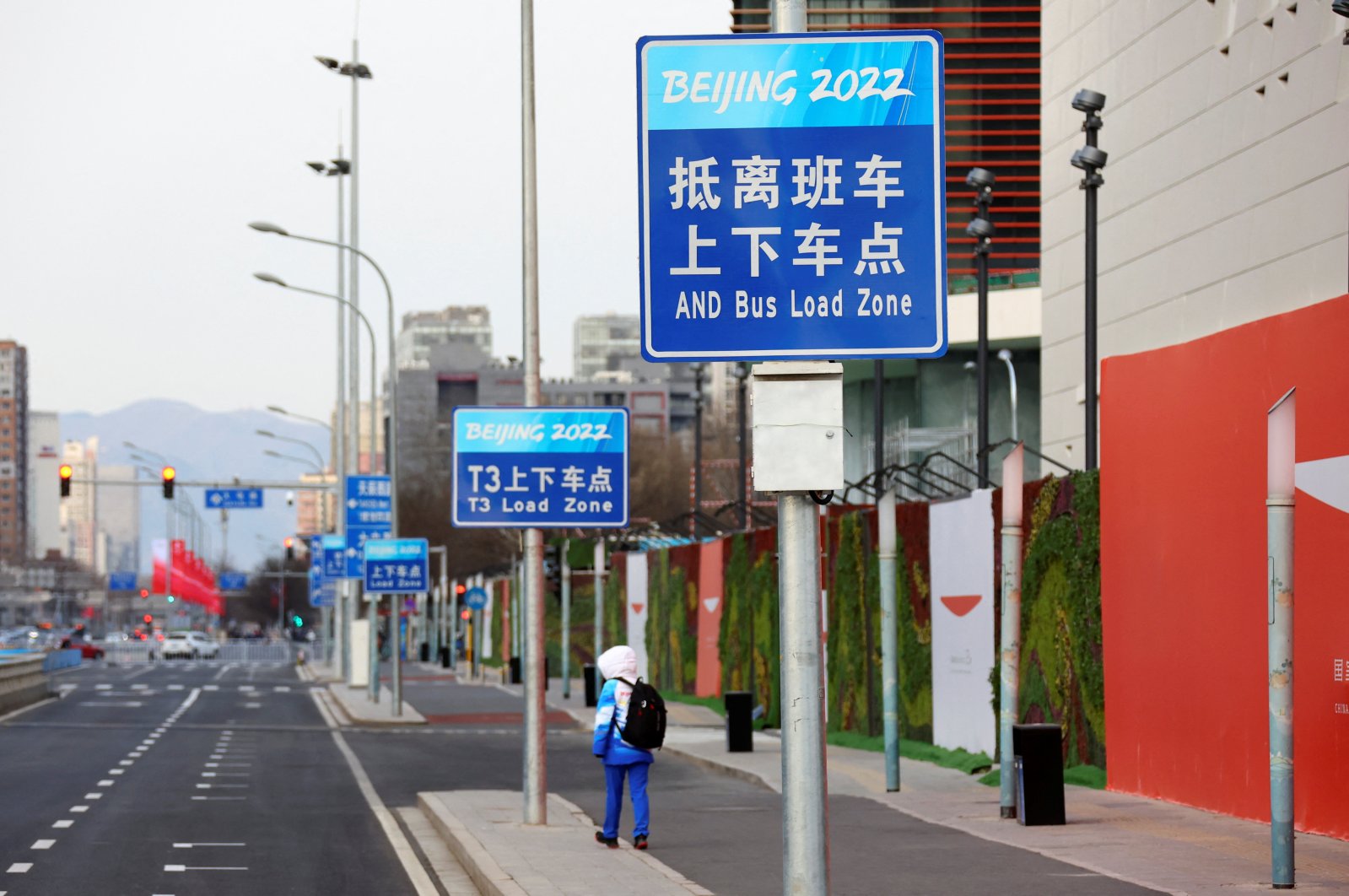 A volunteer walks outside the Main Press Center ahead of the Beijing 2022 Winter Olympics, China, Jan. 11, 2022. (Reuters Photo)