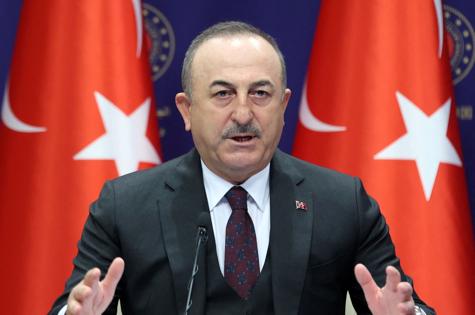 Turkish Foreign Minister Mevlut Cavusoglu addresses a press conference at the Ministry of Foreign Affairs in Ankara, Dec. 27, 2021. (Photo by Adem ALTAN / AFP)