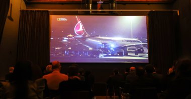 A screen shows Turkish Airlines aircraft during the premiere of "The Great Move" documentary, Istanbul, Turkey, Jan. 12, 2021. (AA Photo)