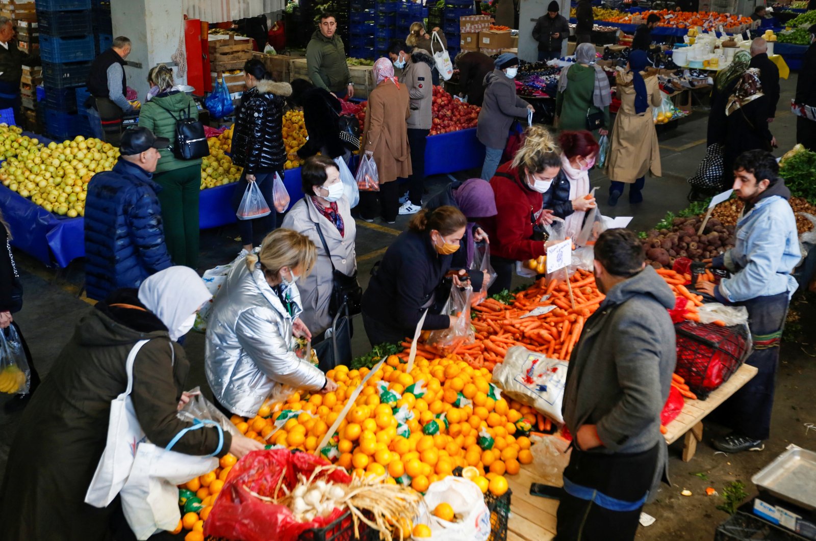 People shop at a fresh market in Istanbul, Turkey, Jan. 4, 2022. (Reuters Photo)