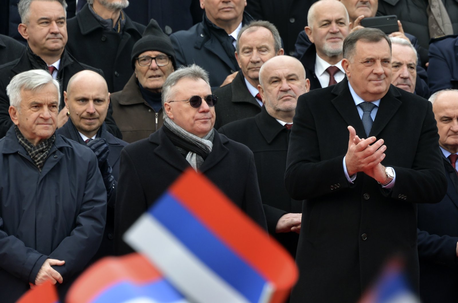 Bosnian Serb political leader Milorad Dodik (front R), applauds during a parade marking the 30th anniversary of the Republic of Srpska in Banja Luka, northern Bosnia, Jan. 9, 2022. (AP Photo)