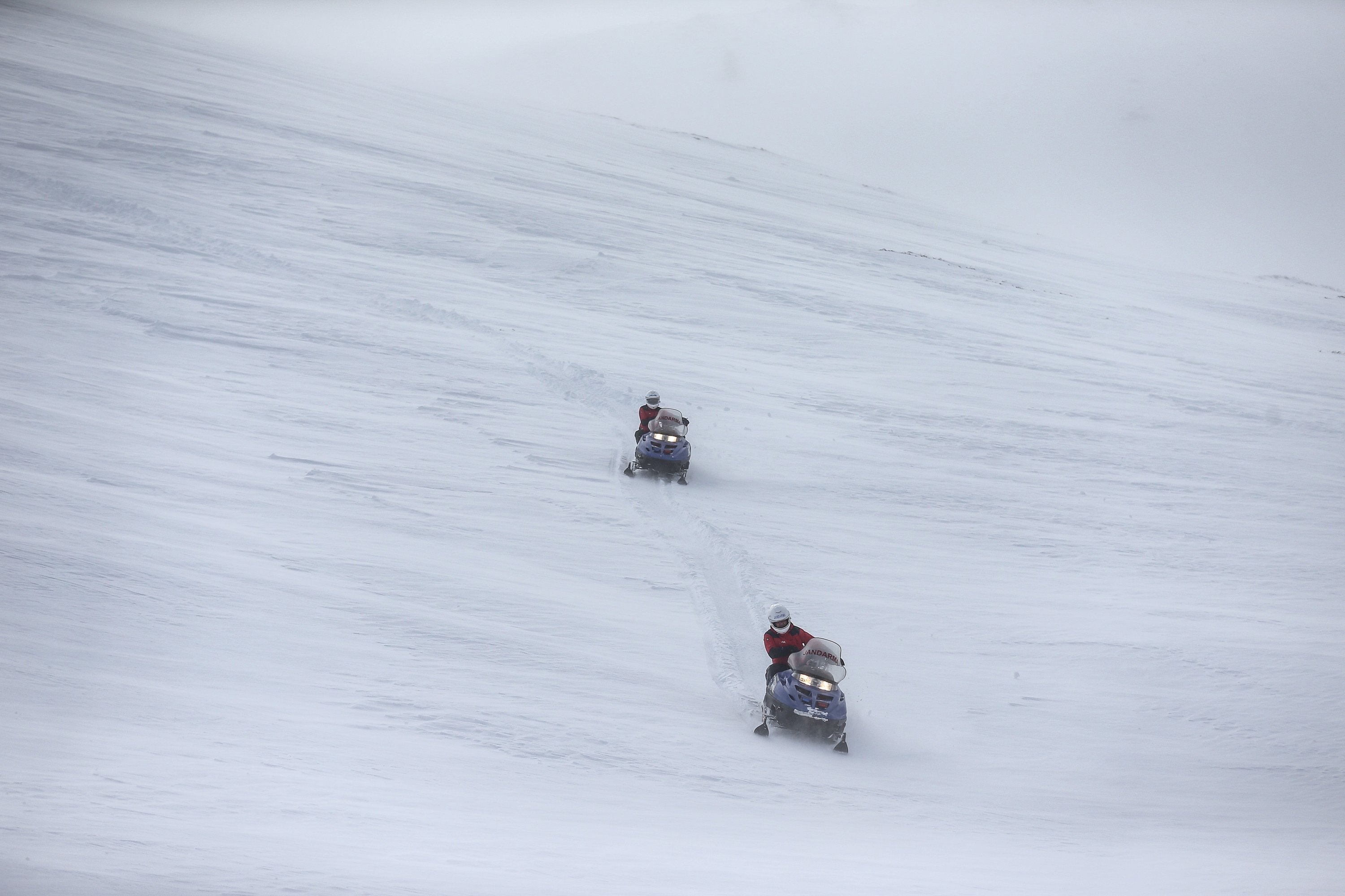 Gendarmerie personnel ride snowmobiles while training in Uludağ, in Bursa, northwestern Turkey, Jan. 13, 2022. (AA PHOTO)