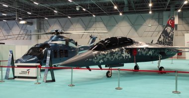 TAI's Gökbey multirole helicopter (L) and Hürjet light attack aircraft (R) showcased during defense fair SAHA EXPO 2021 held between Nov. 10-13 in Istanbul, Turkey. (IHA Photo)