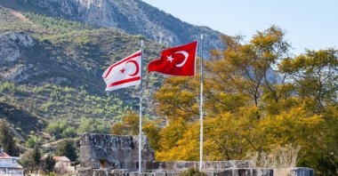 The flags of Turkey and the Turkish Republic of Northern Cyprus (TRNC) fly side by side at Bellapais Abbey in the TRNC, Jan. 27, 2016. (Photo by Shutterstock)