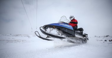 A gendarmerie officer rides a snowmobile in Uludağ, Bursa, northwestern Turkey, Jan. 13, 2022. (AA PHOTO)