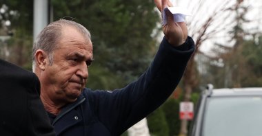 Galatasaray coach Fatih Terim waves at fans as he leaves the club&#039;s Metin Oktay training ground in Istanbul&#039;s Florya, Jan. 11, 2022 (AA Photo)