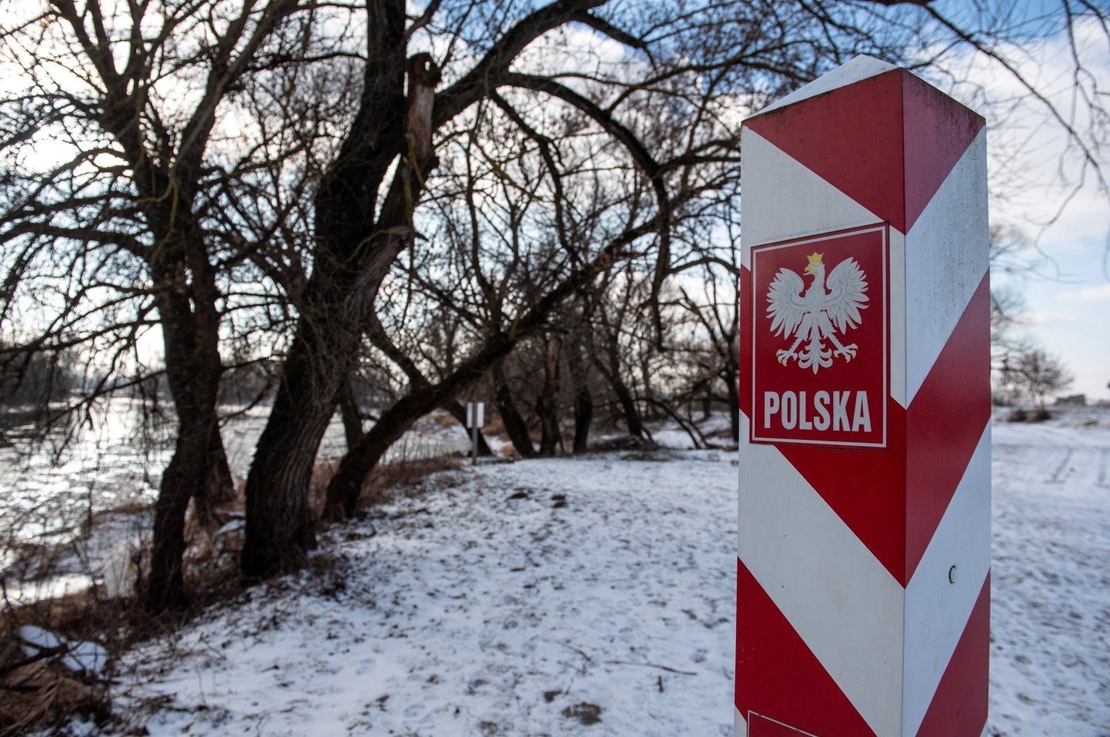 A view of a border marker at the Polish-Belarusian border near Terespol and the Bug River, eastern Poland, Jan. 11, 2022. (EPA Photo)