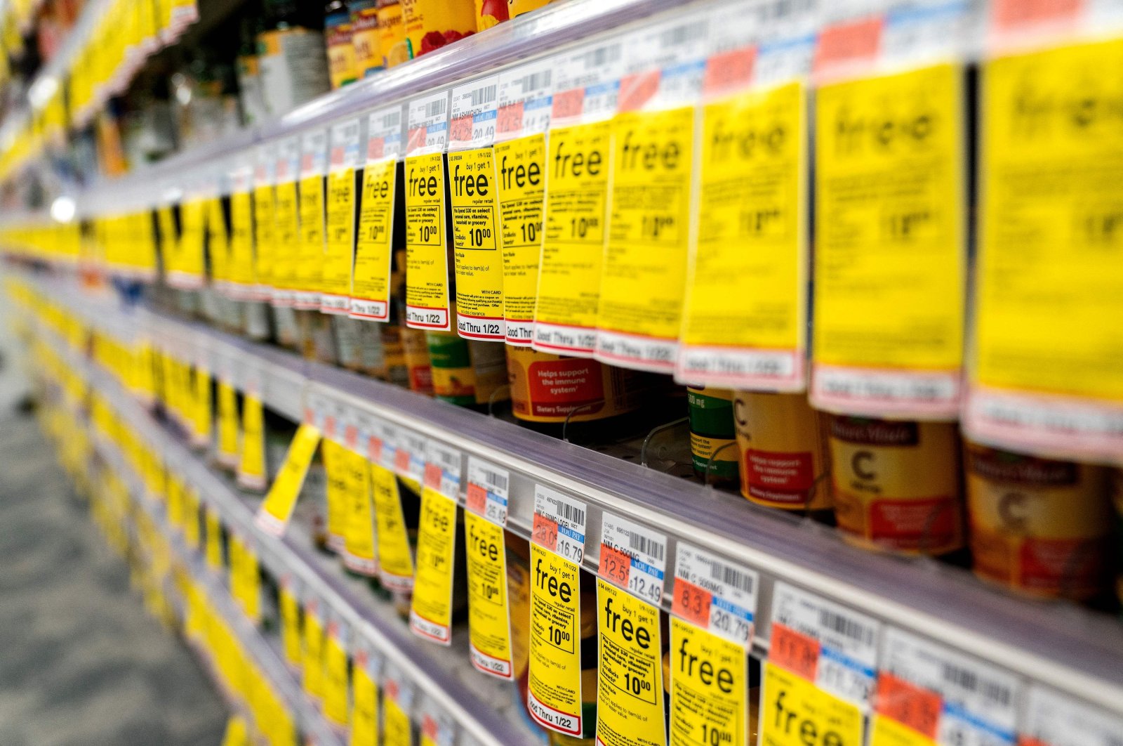 Sale stickers are displayed on shelves at a supermarket in Washington, DC., U.S, Jan. 12, 2022. (AFP Photo)