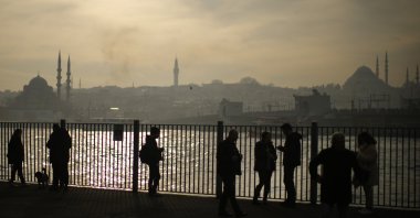 People wait to take a ferry at the Karaköy terminal, in Istanbul, Turkey, Jan. 9, 2022. (AP Photo)