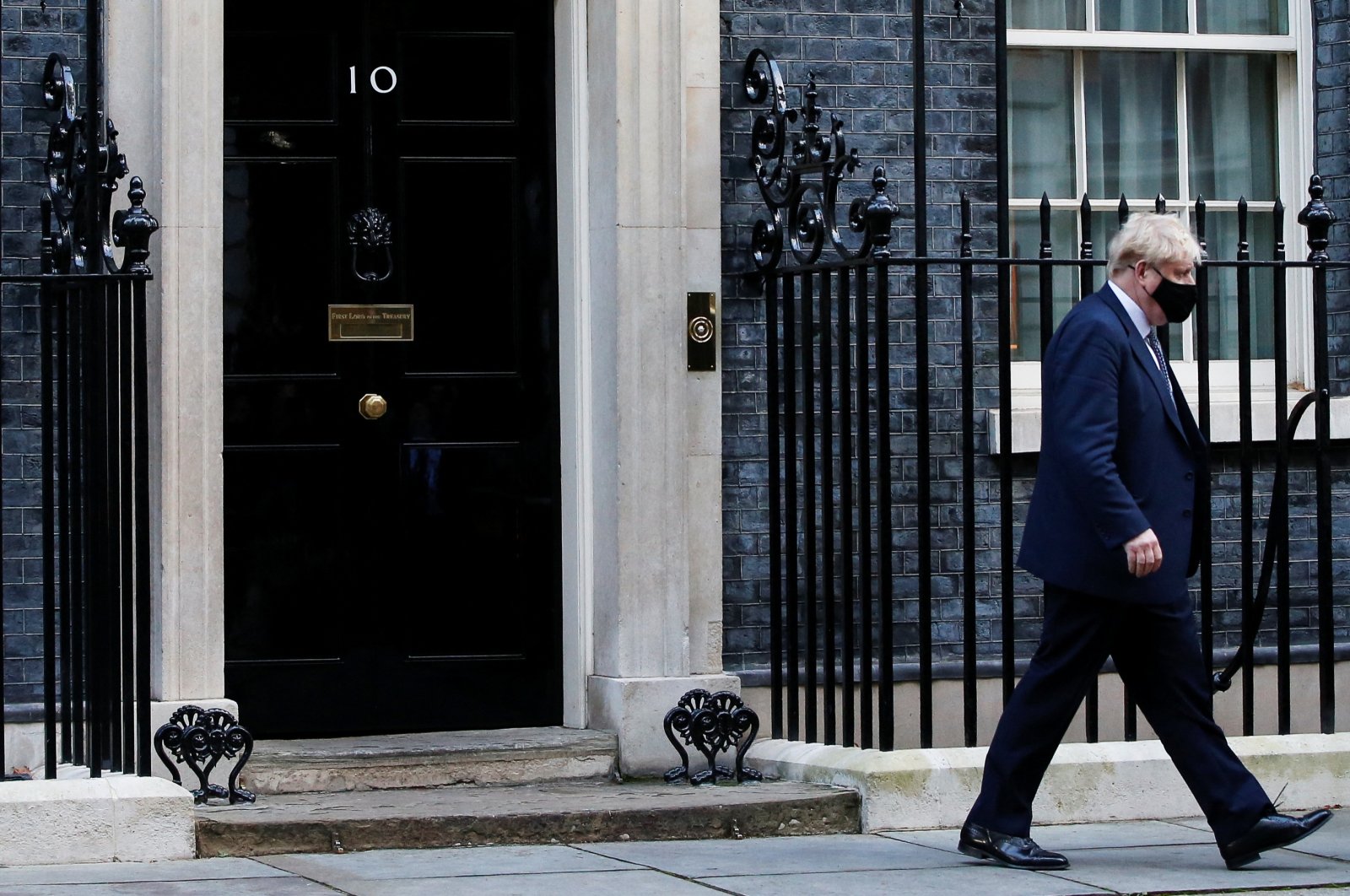 British Prime Minister Boris Johnson walks outside Downing Street in London, Britain, Jan. 12, 2022. (Reuters Photo)