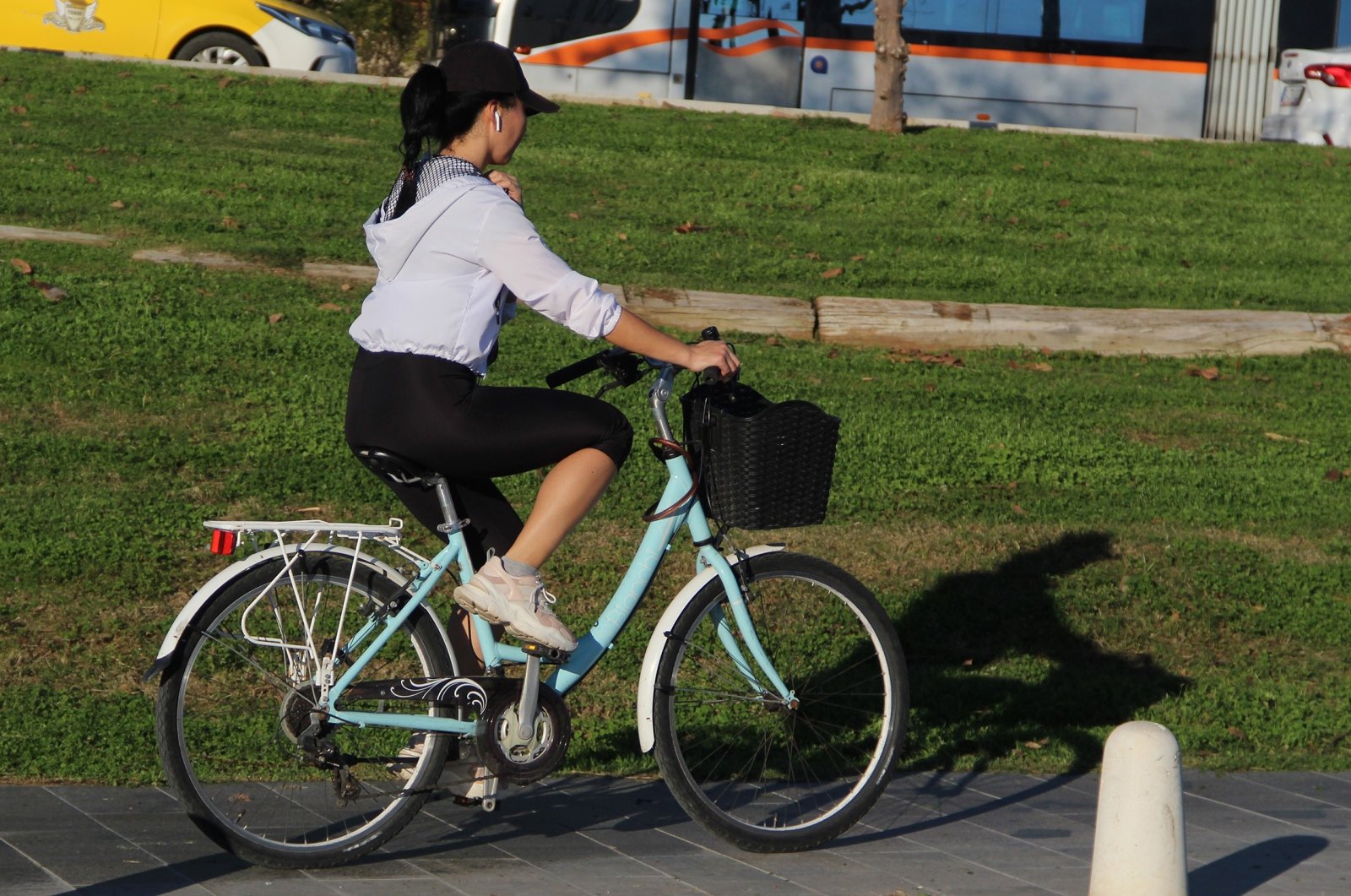 A girl rides a bike, Antalya, Turkey, Jan. 10, 2022. (IHA Photo)