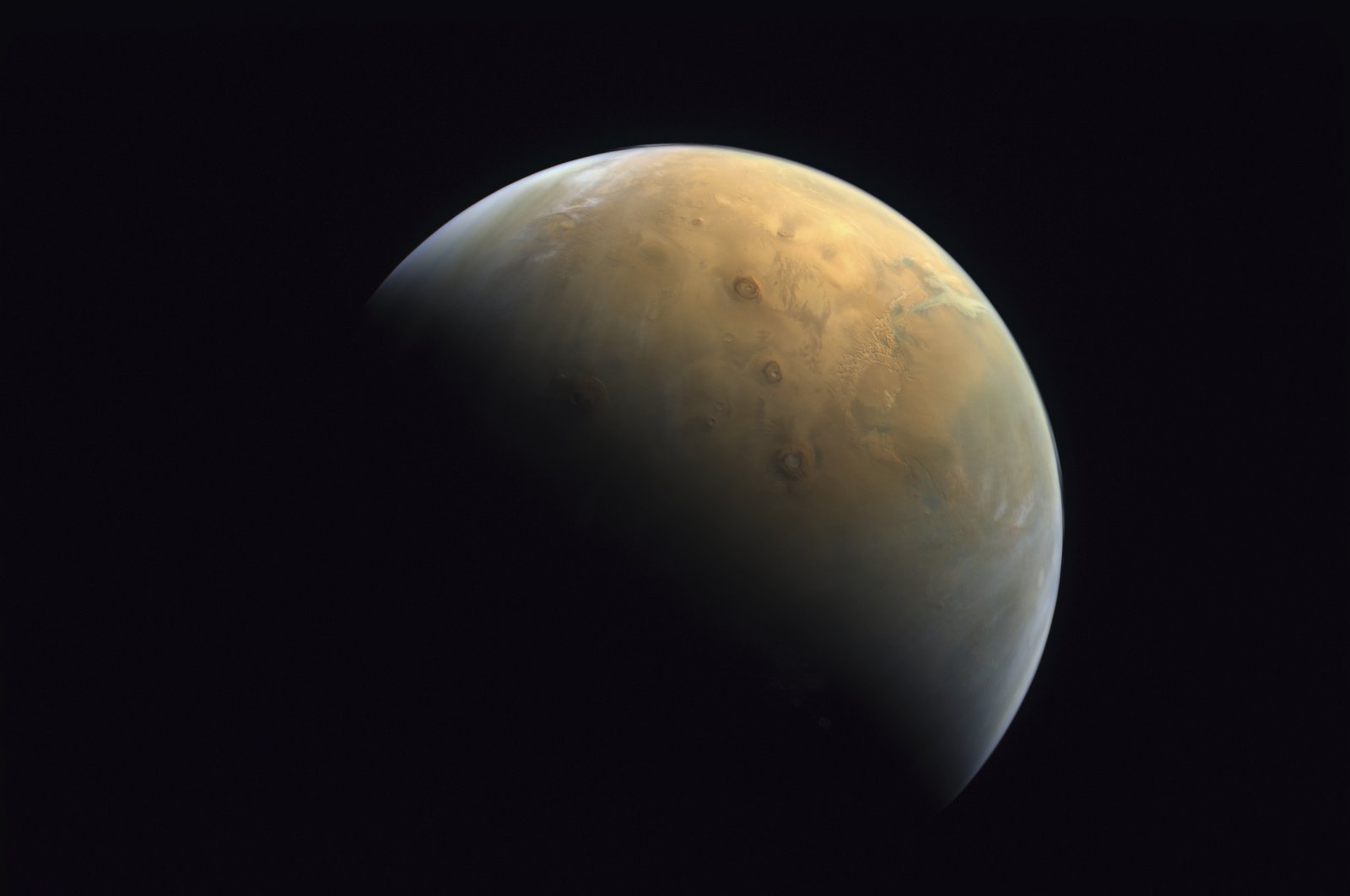 This Feb. 10, 2021 image taken by the United Arab Emirates&#039; &quot;Amal,&quot; or &quot;Hope,&quot; probe released Sunday, Feb. 14, 2021, shows Mars.  (Mohammed bin Rashid Space Center/UAE Space Agency, via AP)
