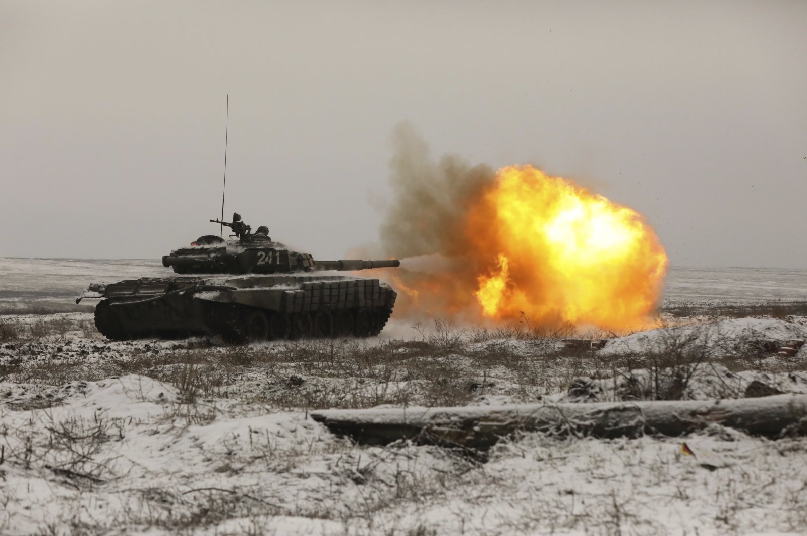 A Russian tank T-72B3 fires as troops take part in drills at the Kadamovskiy firing range in the Rostov region in southern Russia, Wednesday, Jan. 12, 2022. (AP Photo)