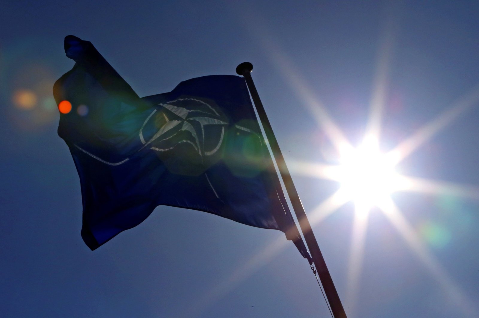 A NATO flag flies at the alliance headquarters in Brussels during a NATO ambassadors meeting on the situation in Ukraine and the Crimea region, March 2, 2014. (Reuters Photo)