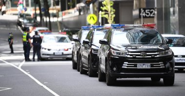 A convoy of Victorian Police vehicles awaits the transfer of Serbian tennis player Novak Djokovic near the exit of the car park at the offices of Novak Djokovic's lawyers in Melbourne, Australia, Jan. 15, 2022. (EPA Photo)