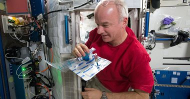 Astronaut Jeff Williams collects a breath sample on board the International Space Station, as can be seen in this undated handout photo. (NASA via Reuters)