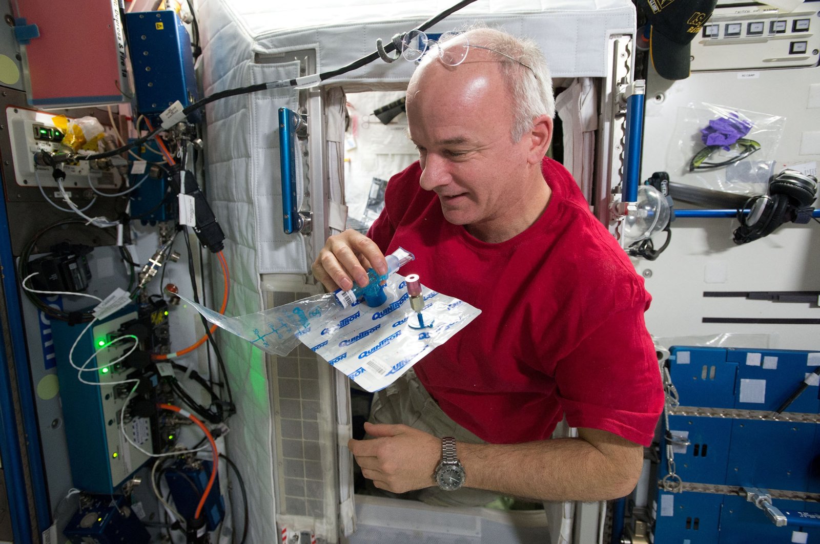 Astronaut Jeff Williams collects a breath sample on board the International Space Station, as can be seen in this undated handout photo. (NASA via Reuters)