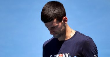 Novak Djokovic of Serbia looks at his racket during a practice session ahead of the Australian Open at the Melbourne Park tennis center, Melbourne, Australia, Jan. 12, 2022. (AFP Photo)