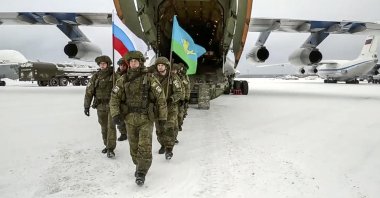 Russian peacekeepers of the Collective Security Treaty Organization (CSTO) leave a Russian military plane after withdrawing its troops at an airport outside Ivanovo, Russia, Jan. 15, 2022. (AP Photo)