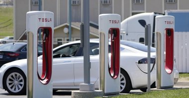 A Tesla charges at a station in Topeka, Kansas, U.S., April 5, 2021. (AP Photo)