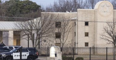 Police stand in front of the Congregation Beth Israel synagogue in Colleyville, Texas, U.S., Jan. 16, 2022. (AP Photo/Brandon Wade)