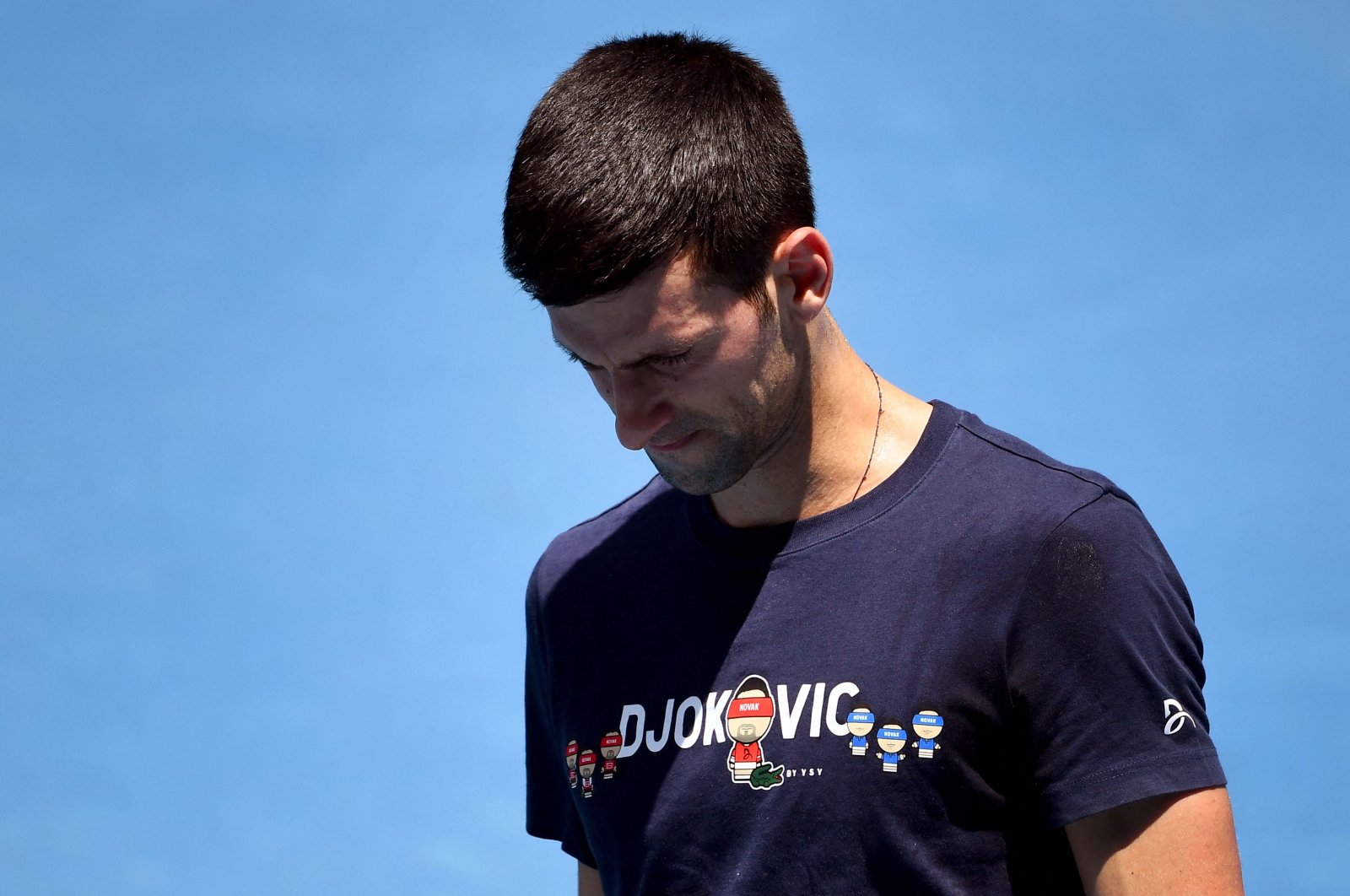Novak Djokovic of Serbia looks at his racket during a practice session ahead of the Australian Open at the Melbourne Park tennis center, Melbourne, Australia, Jan. 12, 2022. (AFP Photo)
