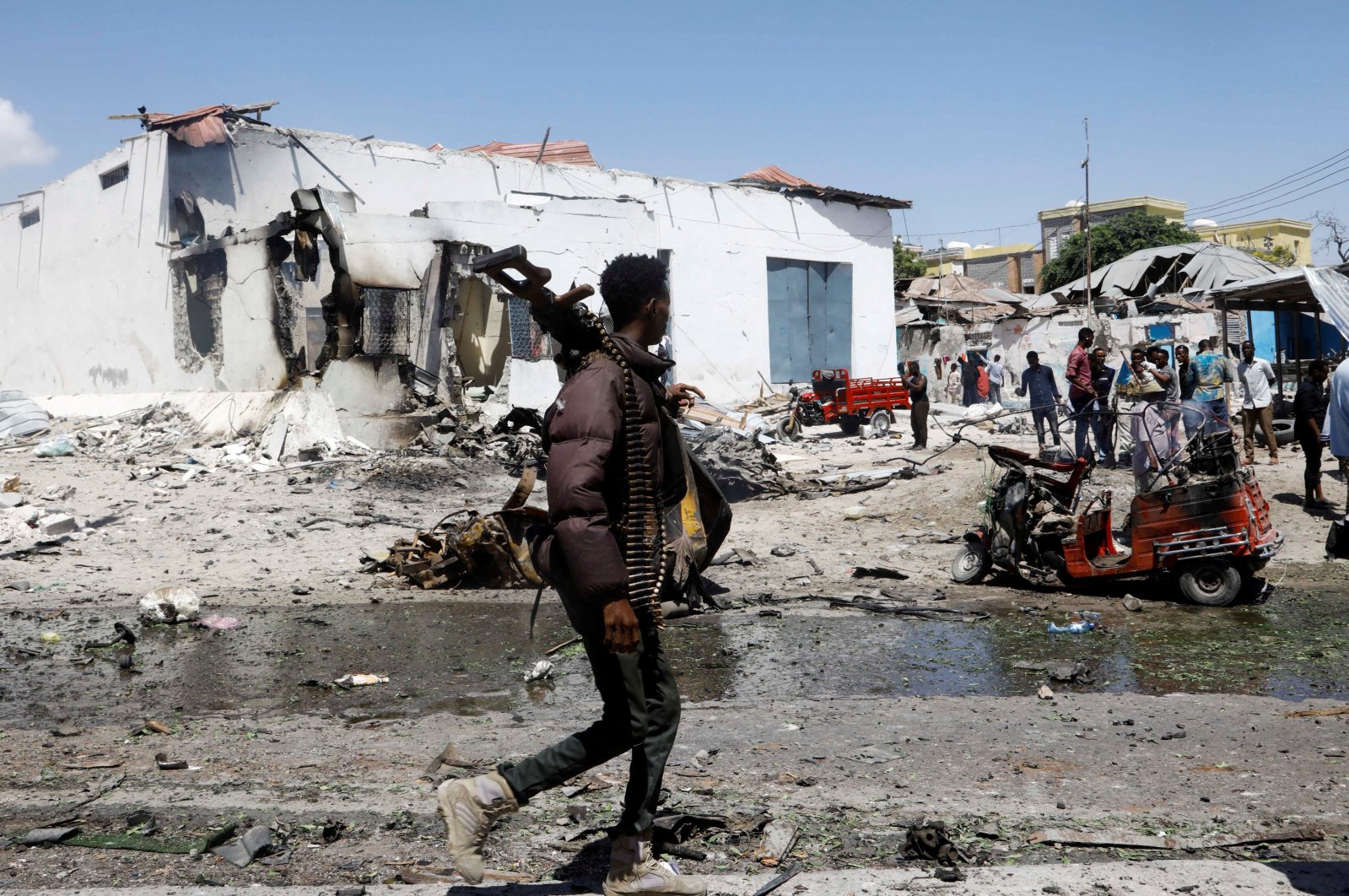 A security officer walks at the scene of an explosion in the Hamarweyne district of Mogadishu, Somalia, Jan. 12, 2022. (Reuters Photo)