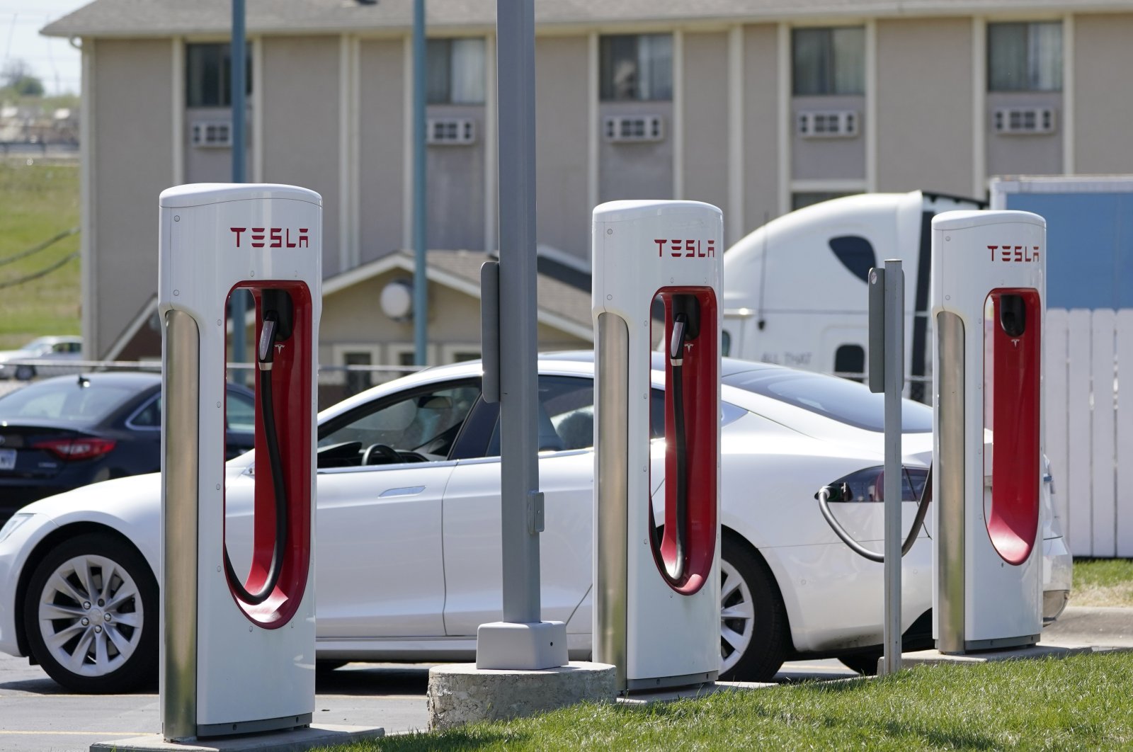 A Tesla charges at a station in Topeka, Kansas, U.S., April 5, 2021. (AP Photo)