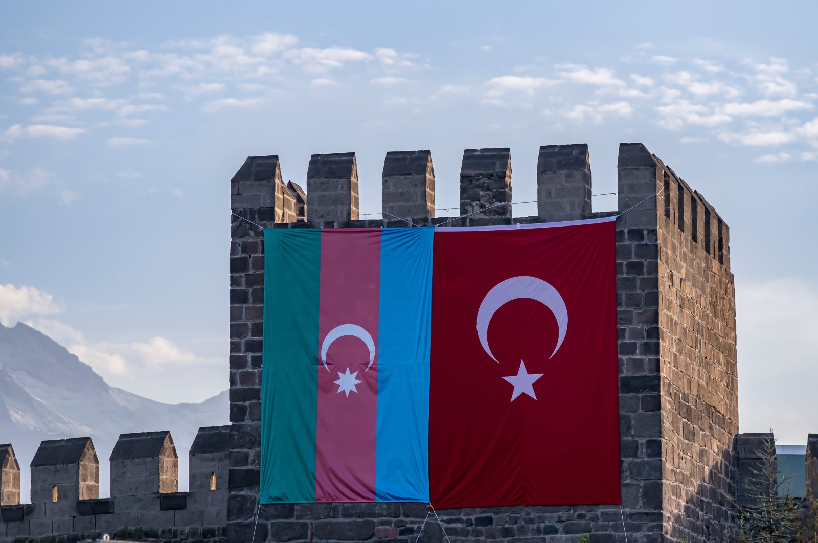 Azerbaijani and Turkish flags hang side by side on the Kayseri castle, Kayseri, Turkey. (Shutterstock Photo)