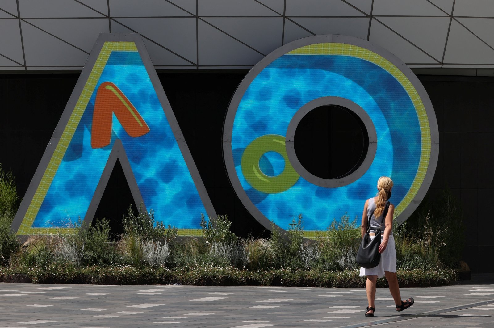 A person walks through Melbourne Park in the lead-up to the Australian Open in Melbourne, Australia, Jan. 12, 2022. (Reuters Photo)