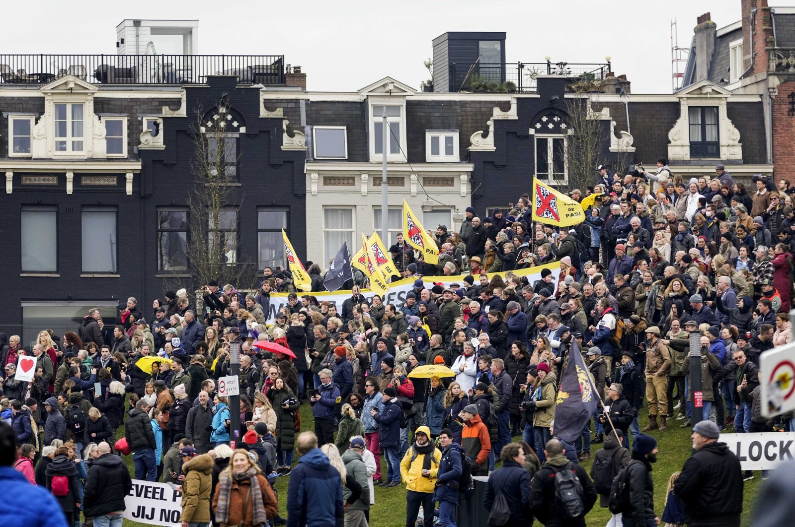 Protesters on the Museumplein during &#039;the commemoration of the coffee battle&#039; action organized by the Dutch activist group called &#039;The Netherlands in Resistance&#039; (Nederland in Verzet) in Amsterdam, the Netherlands, Jan. 16, 2022. (EPA Photo)