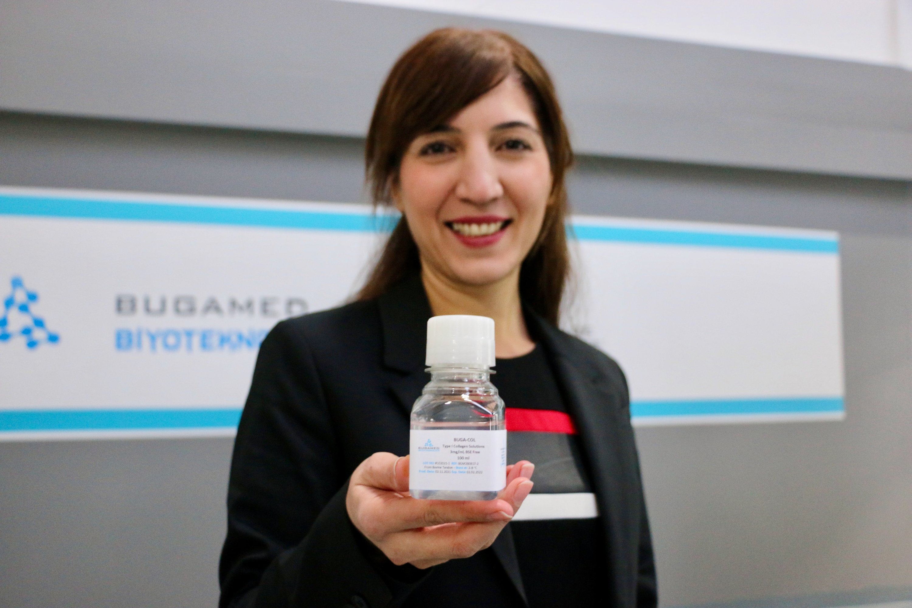 Female entrepreneur and biologist Gamze Kara Mağden stands holding the medical-grade collagen that her company manufactures, Eskişehir, central Turkey, Dec. 28, 2021. (AA Photo)