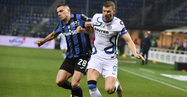 Atalanta's Merih Demiral vies for the ball with Inter's Edin Dzeko during a Serie A match, Bergamo, Italy, Jan. 16, 2022. (AA Photo)