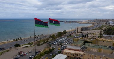 Libyan flags flying over a street in the capital Tripoli, Libya, Feb. 14, 2021. (Photo by Shutterstock)