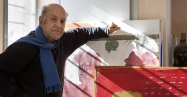 Greek contemporary artist Alekos Fassianos poses with his artworks in his house in Athens, Greece, Jan. 18, 2018. (Louisa Nikolaidou via AFP)
