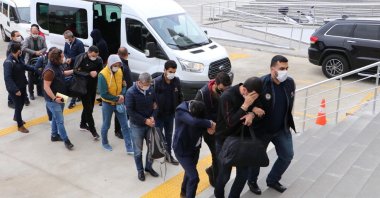 Police officers escort suspects detained in a FETÖ operation, in Tekirdağ, northwestern Turkey, Feb. 24, 2021. (DHA Photo)