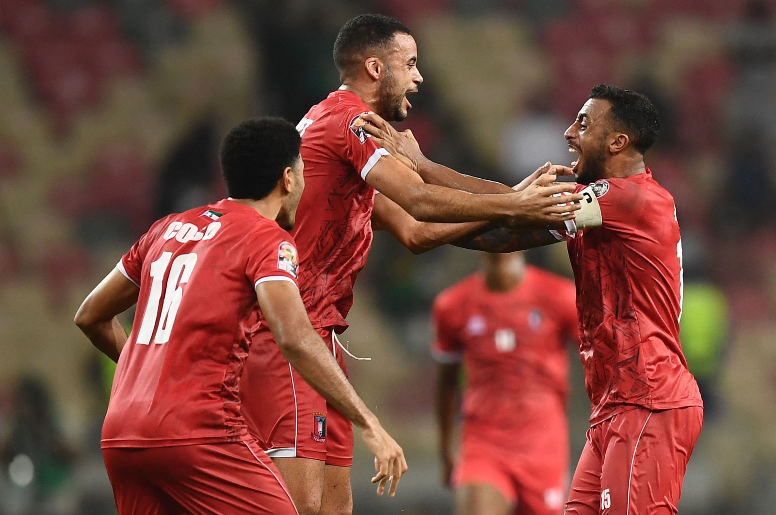 Equatorial Guinea&#039;s Carlos Akapo (R) celebrates with teammates after winning an Africa Cup of Nations match against Algeria, Douala, Cameroon, Jan. 16, 2022. (AFP Photo)