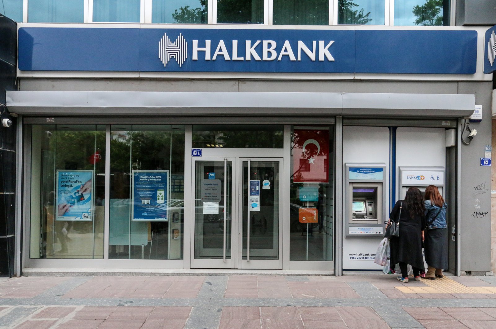 People are seen using ATM machines at Halkbank in the capital Ankara, Turkey, Jan. 5, 2021. (Reuters Photo)