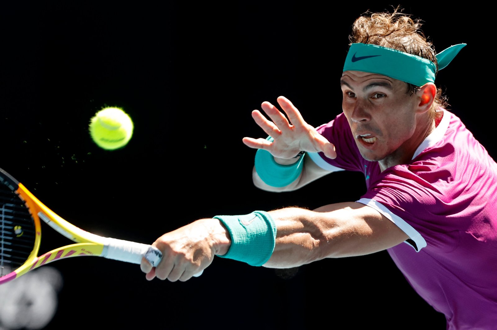 Rafael Nadal in action against Marcos Giron during their Australian Open first-round match in Melbourne, Australia, Jan. 17, 2022. (AFP Photo)