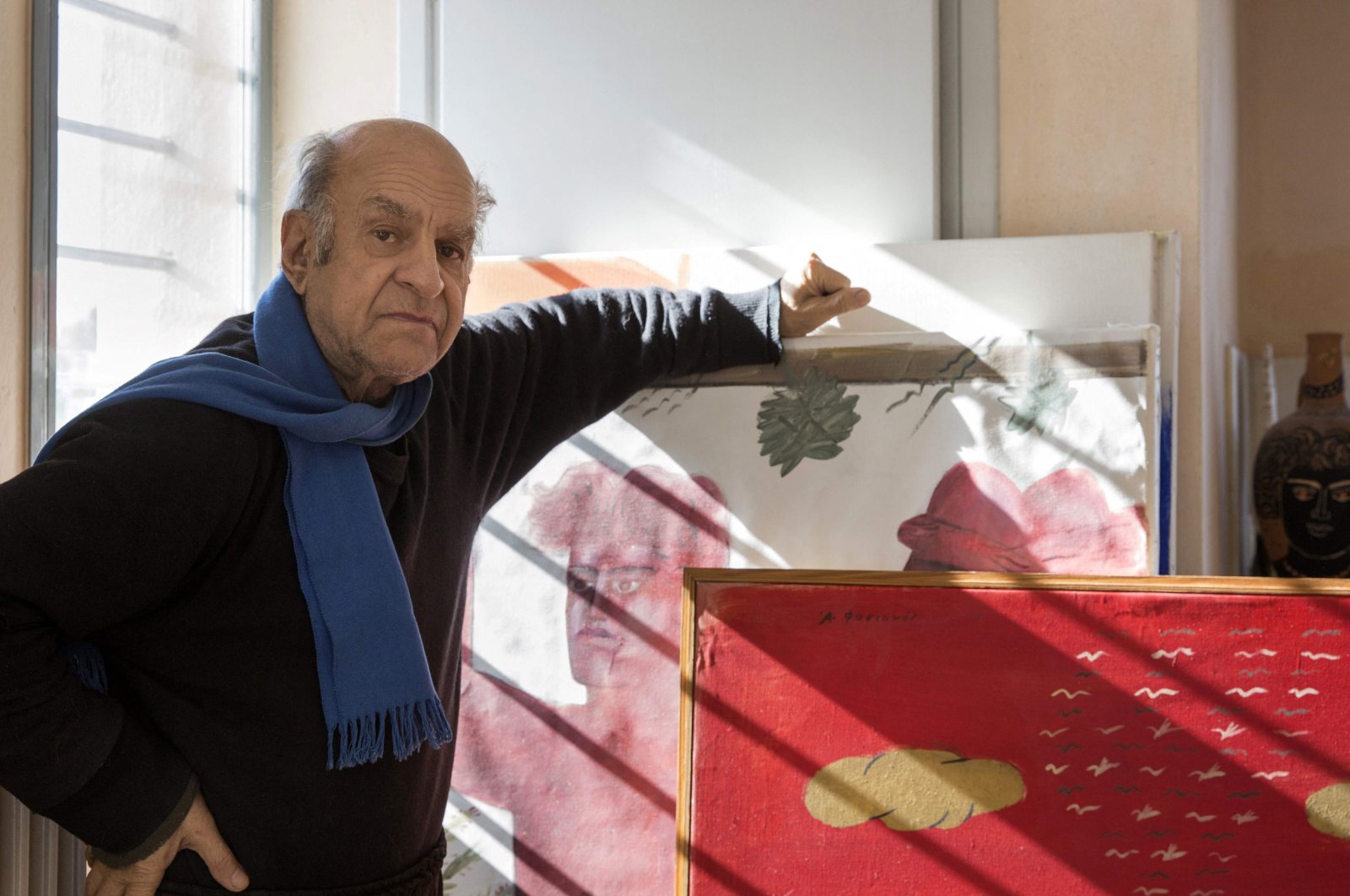 Greek contemporary artist Alekos Fassianos poses with his artworks in his house in Athens, Greece, Jan. 18, 2018. (Louisa Nikolaidou via AFP)