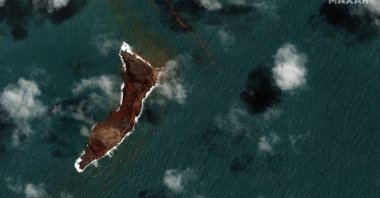 This satellite image by Maxar Technologies shows a view of Hunga Tonga Hunga Ha’apai volcano in Tonga, Jan. 18, 2022 after a huge undersea volcanic eruption. (AP Photo)