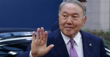 Kazakh President Nursultan Nazarbayev waves as he arrives for a Asia Europe Meeting (ASEM) at the European Council in Brussels, Belgium, Oct. 19, 2018. (AFP Photo)