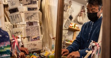 Mitsuhiro Fujimoto, an operator for Majerca, can be seen at a store in the Kichijoji district in Musashino area in Tokyo, Japan, Oct. 7, 2021. (AFP Photo)