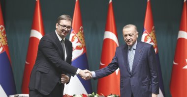 President Recep Tayyip Erdoğan (R) shakes hands with his Serbian counterpart Aleksandar Vucic after the press conference at Ankara's Presidential Complex on Jan. 18, 2022 (AA Photo)