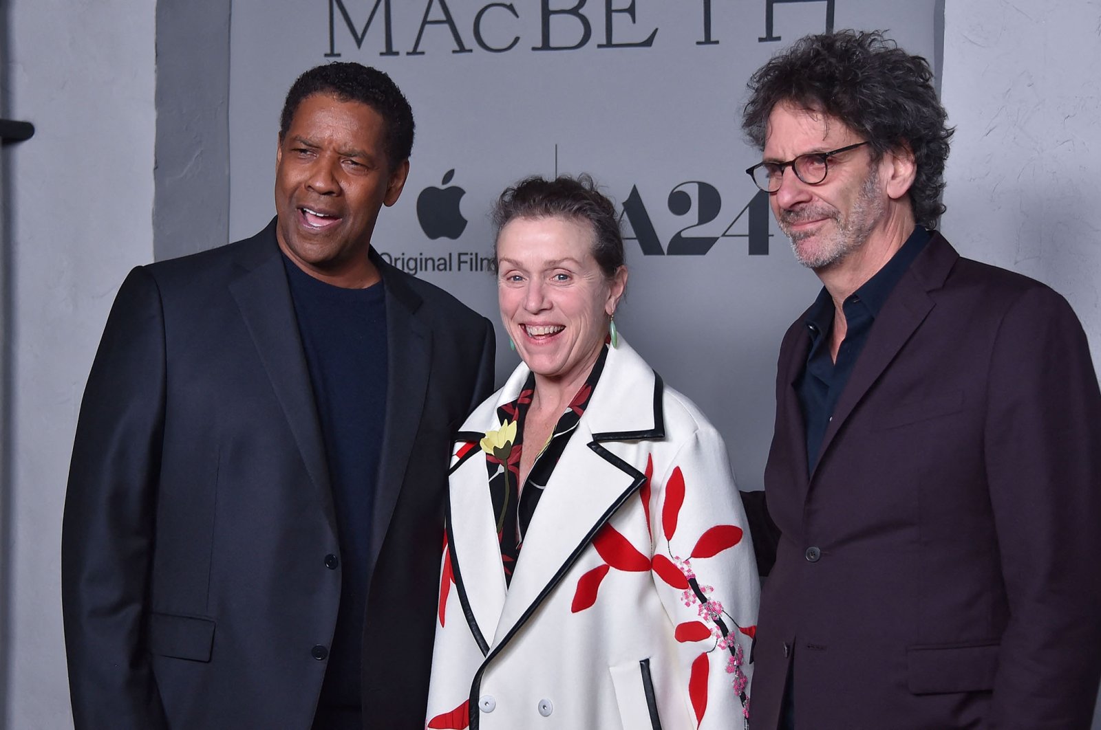 Denzel Washington (L), Frances McDormand (C) and Joel Coen attend the Los Angeles Premiere of &quot;The Tragedy of Macbeth&quot; at the Directors Guild of America Theater in Los Angeles, California, U.S., Dec. 16, 2021. (AFP Photo)